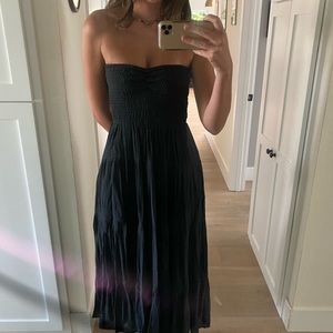 Long black dress. Tight fitted top.